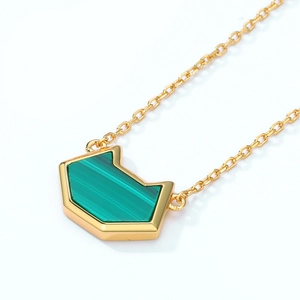 Detailed close-up of malachite feline silhouette pendant on a 10K gold-plated silver chain