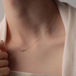 Elegant 925 sterling silver geometric opal necklace with gold finish on a female model