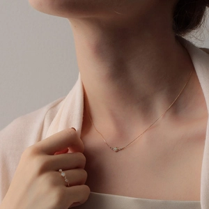 Detail of S925 sterling silver opal jewelry set featuring thin gold chain and ring