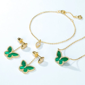 Elegant gold butterfly jewelry set with green malachite inlay and sparkling crystals