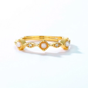 Elegant gold S925 silver ring featuring three shell pearls and sparkling crystal accents