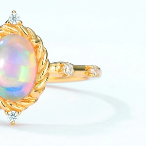 Elegant 925 silver opal ring with gold finish and sparkling zircon accents in macro view