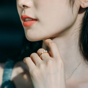 Elegant 925 sterling silver gold plated ring featuring three lustrous round pearls