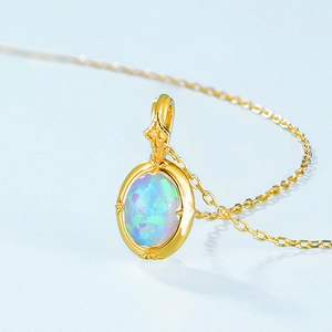 French vintage opal necklace in gold finish with starburst detail and blue-green hues