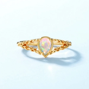 Vintage gold S925 silver ring featuring a pear-cut opal with rainbow iridescence