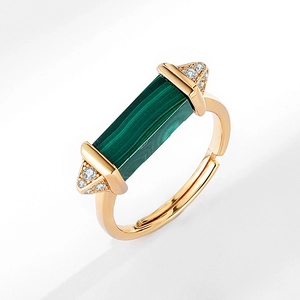 Detail of gold adjustable ring with rectangular malachite stone and zircon accents