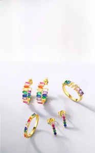 Detailed macro view of rainbow cubic zirconia stones set in gold plated fashion earrings