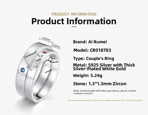 Detailed view of S925 silver couple rings with blue and red zircon stones and engravings