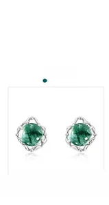 Detailed view of S925 silver earrings featuring green agate stones and lace hollow design