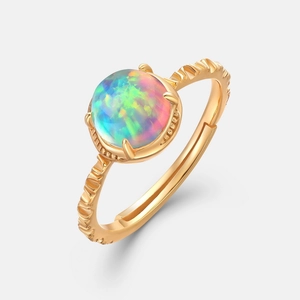 Vintage golden S925 silver ring featuring a round iridescent opal stone and textured band