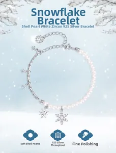 Detail of S925 silver snowflake bracelet with shell pearls and sparkling white zircons