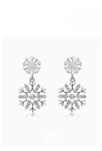 Macro shot of S925 sterling silver snowflake earrings with sparkling white cubic zirconia