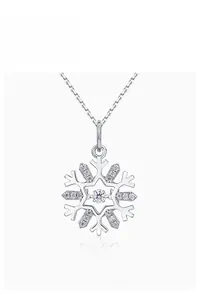 Macro detail of S925 sterling silver snowflake pendant with shimmering cubic zirconia