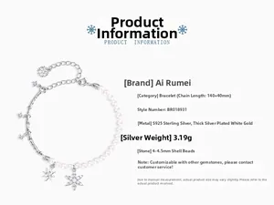Detail of S925 silver bracelet with shell pearls, snowflake charms and star pendants