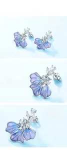 Detailed macro view of S925 silver blue iris earrings with plique-a-jour enamel finish