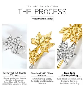 Macro detail of S925 sterling silver maple leaf earrings with 5A zircon and bicolor plating