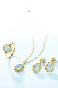 Detailed close-up of vintage opal jewelry set with intricate hollowed gold patterns