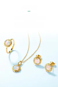 Detailed set of 925 silver gold-plated jewelry with round opal stones and twisted design