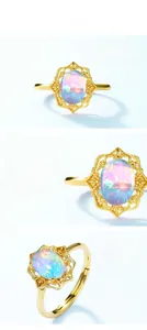 Macro shot of oval opal stone set in S925 sterling silver with detailed floral engraving
