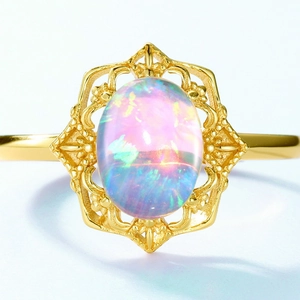 Vintage gold S925 silver ring with large oval opal in a filigree hexagon setting