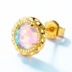 Macro view of S925 sterling silver opal stud earrings with twisted rope gold border