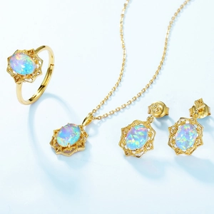 Vintage gold filigree jewelry set with oval opal stones including ring necklace earrings