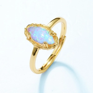 Vintage gold open ring with oval opal gemstone and feather texture border detail