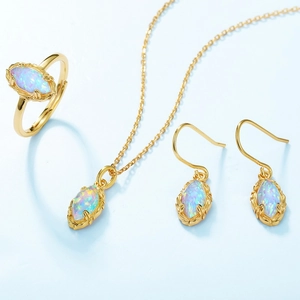 Retro S925 silver opal jewelry set featuring marquise cut stones and golden vine design