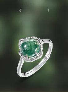 Detail of natural green moss agate ring with leaf-shaped S925 sterling silver prong setting