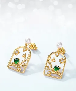 Detail of S925 silver plum blossom earrings with green jade, pearls and zircon accents