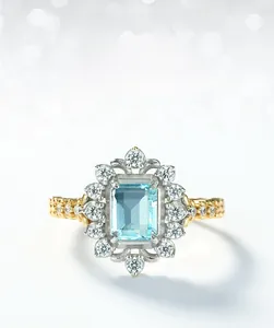 Macro shot of Sky Blue Topaz ring with rectangle cut, silver halo and gold woven band