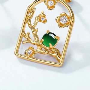 Macro detail of plum blossom emerald earring in S925 sterling silver with gold finish