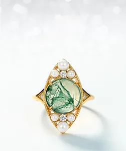 Macro detail of moss agate ring with marquise shell pearls and golden setting