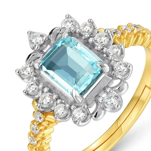 Macro shot of S925 silver ring featuring emerald-cut blue topaz and pavé diamonds