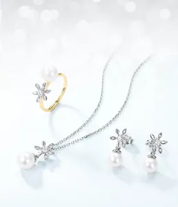 Macro detail of magnolia flower jewelry set with pearls and zircons in S925 silver