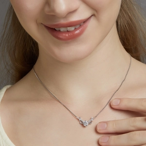 Close-up of S925 sterling silver elk horn heart pendant necklace on model collarbone
