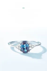 Macro detail of oval cut alexandrite ring in S925 sterling silver with side diamonds