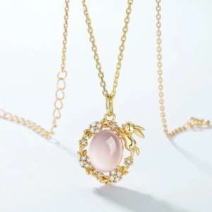 Golden S925 silver necklace featuring a cute rabbit pendant with a pink quartz stone