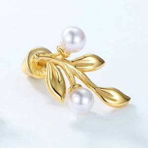 Detail of S925 sterling silver leaf earring with pearls and gold plating finish