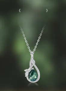 Macro detail of teardrop natural moss agate pendant with S925 sterling silver leaf accents