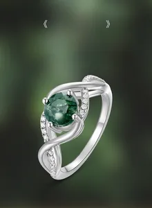 Detailed shot of S925 silver wavy ring featuring a natural green moss agate stone