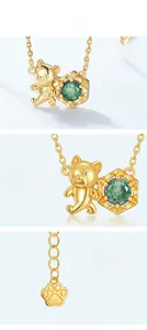 Detail of s925 silver bear pendant with green moss agate and gold plating finish