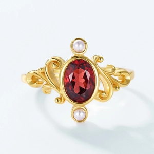 Vintage gold crown ring with red garnet and white pearls in elegant palace style