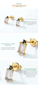 Detail of S925 silver gold-plated studs with rectangular labradorite and black stone