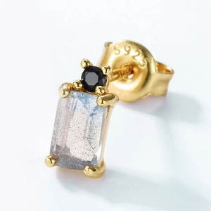 Macro detail of S925 sterling silver gold-plated earring with blue labradorite stone