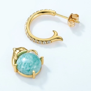 Detailed view of dolphin earrings with amazonite stone and fish tail hoop in gold finish