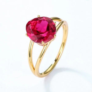 Minimalist S925 silver ring with large red faceted gemstone in a four-prong gold setting