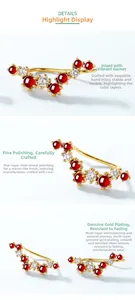 Detail of garnet ear crawler with gold plating and zircon settings from multiple angles