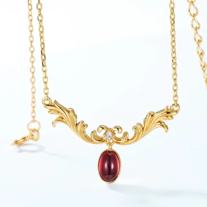 Vintage gold necklace with ornate S925 silver pendant and red oval garnet gemstone