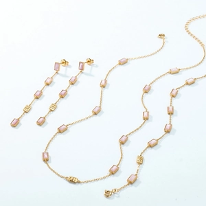 Elegant gold jewelry set with pink shell pendants including necklace bracelet and earrings